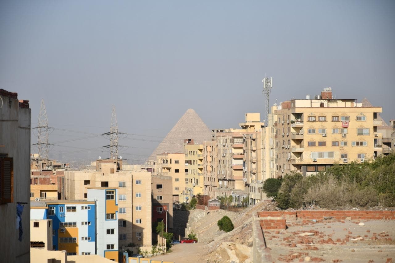 The Great Pyramid rising behind the neighbourhood, seen from the house